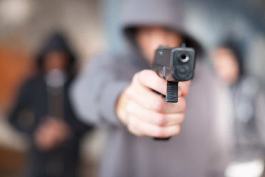 Manslaughter 1 Man with gun pointed at viewer